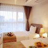 Отель Qingdao Sweetome Vacation Rental (Damuzhi Finance Square), фото 6