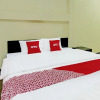Отель OYO 92001 Unram Guest House, фото 7