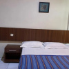 Отель OYO 93502 Homestay Pakmuklis Syariah 2, фото 3