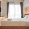 Отель Comfy And Warm Studio Room At Sky House Bsd Apartment, фото 1