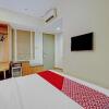 Отель OYO 3905 Graha 100 Guest House Syariah, фото 14