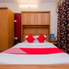 Отель OYO 12082 Om Apartment, фото 13
