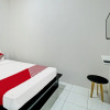 Отель OYO 92433 Sirih Gading Family Guest House, фото 6