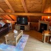 Отель Woodpecker Log Cabin with hot tub, pizza oven bbq entertainment area, lakeside with private fishing , фото 27