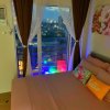 Отель Comfycosy 1-br With Stunning City View at The Loop, фото 12