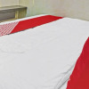 Отель OYO 90737 Losmen Aini Syariah, фото 10