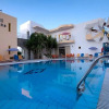 Отель Cosmi Poolside Apartments, фото 11