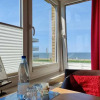 Отель Ferienwohnung-4-Strandnah-und-mit-Meerblick-im-Haus-Seeluft-zentral-in-Duhnen, фото 10