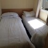 Отель Immaculate 3-bedroom Caravan on Combe Haven, фото 4