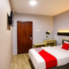 Отель OYO 44066 Unikarya Lodge, фото 15