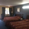 Отель Guest Inn & Suites, фото 3