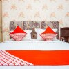 Отель OYO 433 Nelvi Guest House Syariah, фото 22