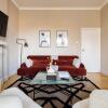 Отель The Ealing Escape - Elegant 2BDR Flat With Parking в Лондоне