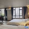 Отель Foshan Nuanju Light Luxury Apartment, фото 2