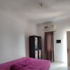 Отель OYO 93252 Garuda Bandara Guesthouse, фото 3