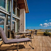 Отель Ostsee Reetdachhaus Nr 40 Utkiek im Strand Resort, фото 1