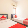 Отель OYO 863 Tenacity Guest House Syariah, фото 4