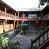 Отель Lijiang Red Flower Inn в Лицзяне