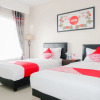 Отель OYO 696 Hasanah Guest House Syariah De Saphire, фото 6
