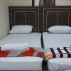 Отель OYO 91065 Guest House 19 Syariah, фото 8