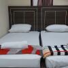 Отель OYO 91065 Guest House 19 Syariah, фото 5