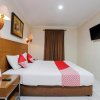 Отель OYO 919 Hotel Kalisma Syariah Near RS Pelni, фото 4