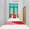 Отель OYO 91960 Fariza House Syariah, фото 13