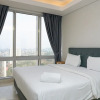 Отель Modern and Comfortable 2BR at The Empyreal Condominium Epicentrum Apartment, фото 15