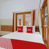 Отель OYO 92533 Harjuna Guest House, фото 8