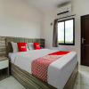 Отель OYO 90164 La'rissa Residence, фото 3