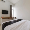 Отель Super OYO Collection O 90023 Damar Kusumo Guest House, фото 8