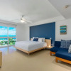Отель Oceanfront Penthouse 4BR w Roof Top Deck w Jacuzzi Eagle Beach, фото 3