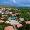 Отель Tropical bungalow in Seru Coral Resort Curacao with beautiful gardens, privacy and large pool, фото 6