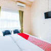 Отель OYO 3434 Penginapan Keluarga Syariah, фото 7