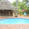 Отель Tiki Getaway 3/2 for 8 Heated Pool, Tiki Hut, Bar, фото 14