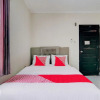 Отель OYO 92861 Raya Guest House Syariah, фото 7