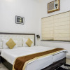 Отель OYO 6774 Apartment The White Feathers, фото 18