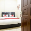 Отель OYO 723 Penginapan Nia Mandiri Syariah, фото 4