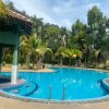 Отель OYO HOME 90700 Teluk Batik Holiday Apartment, фото 28