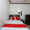 Отель OYO 15027 Hotel Lotus International, фото 7