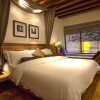 Отель Lijiang Joyful Boutique Hotel в Лицзяне