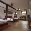 Отель Lijiang Guan Shan Yue Na Xi Style Inn, фото 4