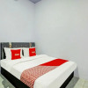 Отель OYO 90604 Menara Sakti Syariah Homestay, фото 6