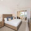 Отель The Beachcomber - Three Bedroom 2nd FL Oceanfront Condos в Ист-Энде