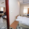 Отель Dalian Yunzhong Zhixing Business Hotel, фото 4