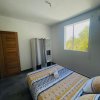 Отель Charmant appartement coloré proche de la plage в Буйаянте