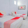 Отель OYO 421 Alianda Guest House Syariah, фото 7
