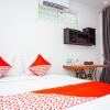 Отель OYO 433 Nelvi Guest House Syariah, фото 3