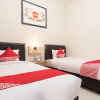 Отель Kamani Homestay Syariah by OYO Rooms, фото 6