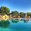 Отель Gir Lions Paw Resort With Swimming Pool в Сазане